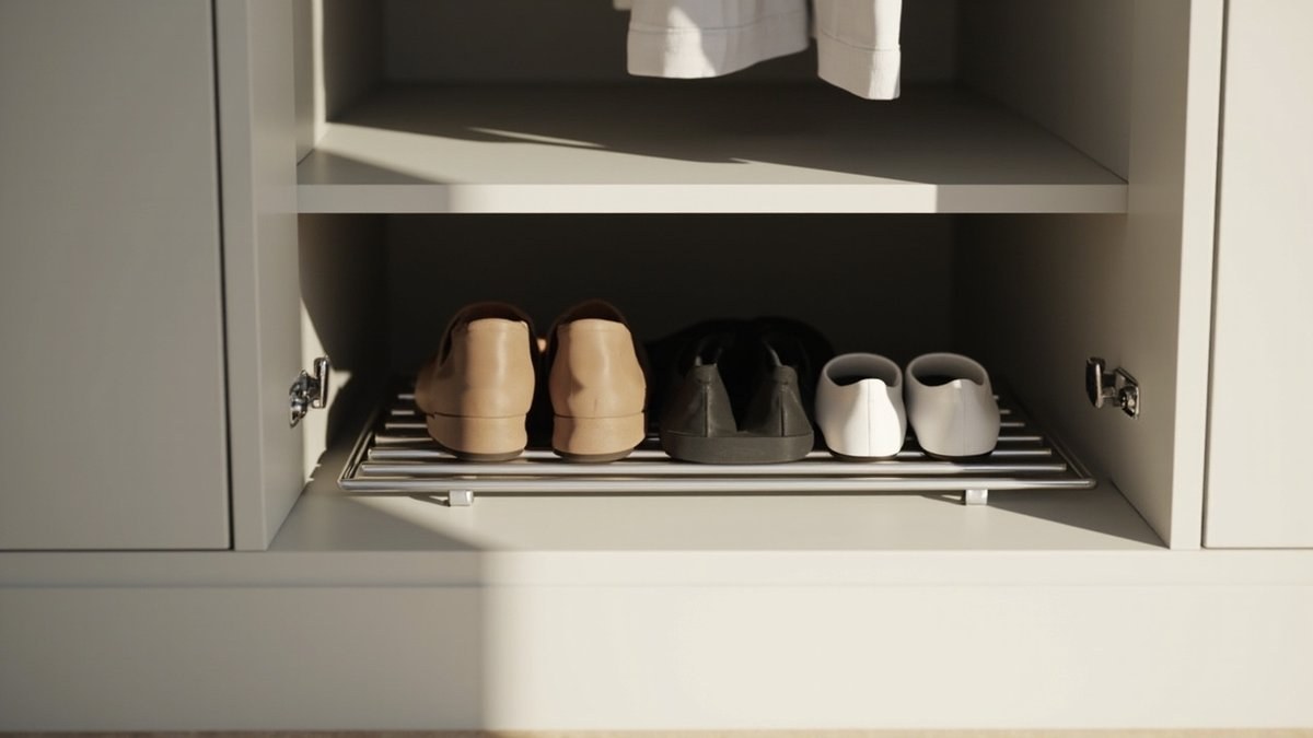 Illustrative concept design: pale grey wardrobe base with a chrome wire shoe rack holding tan, black and white shoes