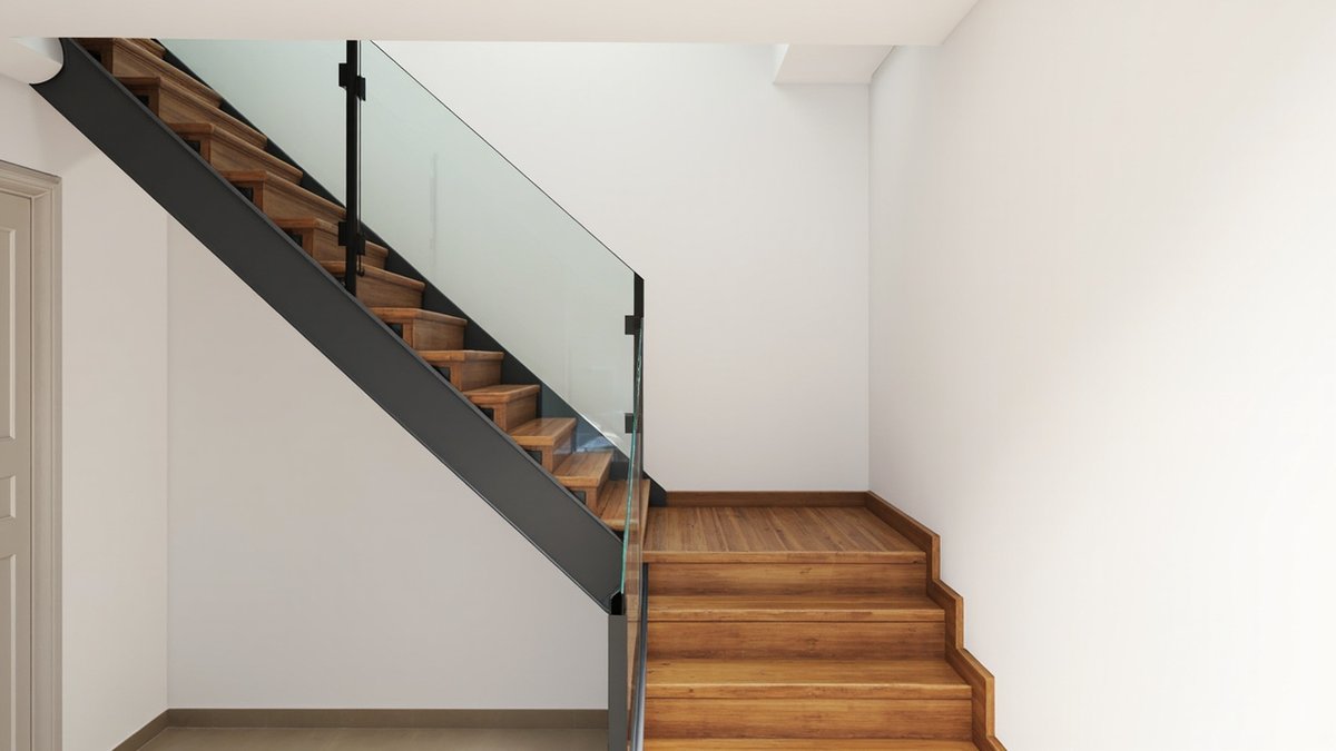 Illustrative concept design: stair with timber treads on a dark steel stringer and a glass balustrade along a white wall