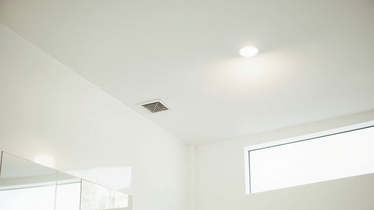 Flat calcium silicate board false ceiling in a bathroom
