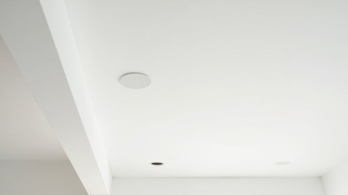 Flat white gypsum board false ceiling with recessed downlights