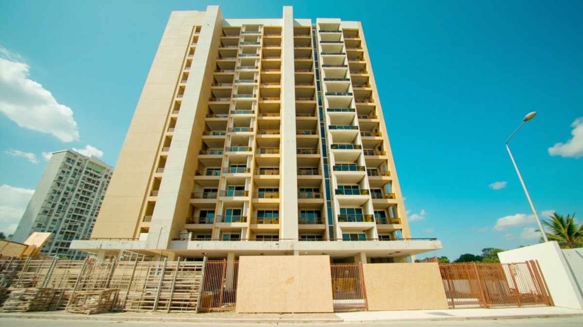 A newly finished condo facade with scaffolding coming down before the JMB forms