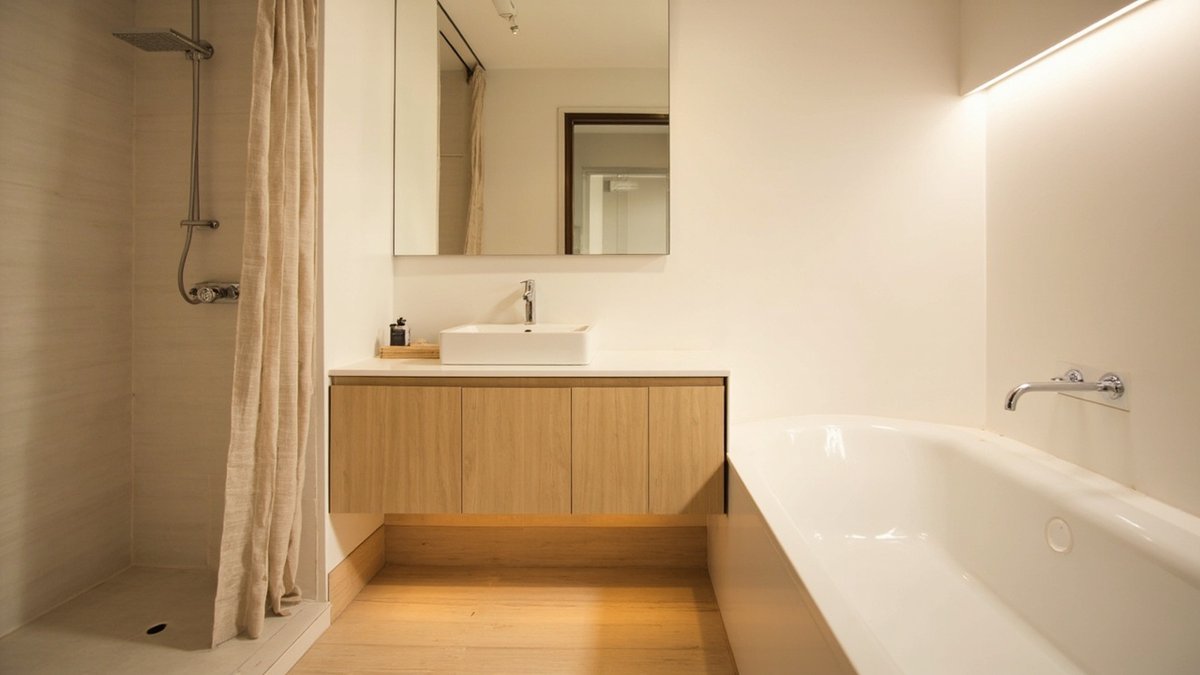 Illustrative concept design: linen-look curtain closing the shower beside a dry oak-look vanity