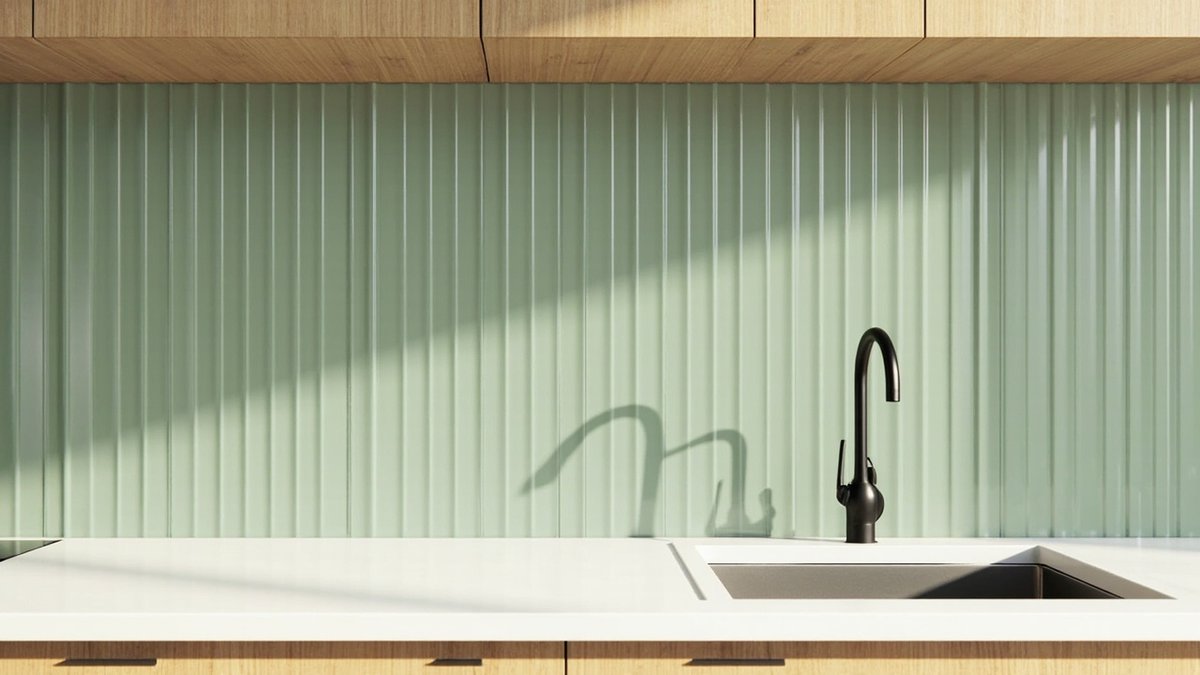 Illustrative concept design: slim glossy sage green vertical tiles between oak cabinets and a white worktop