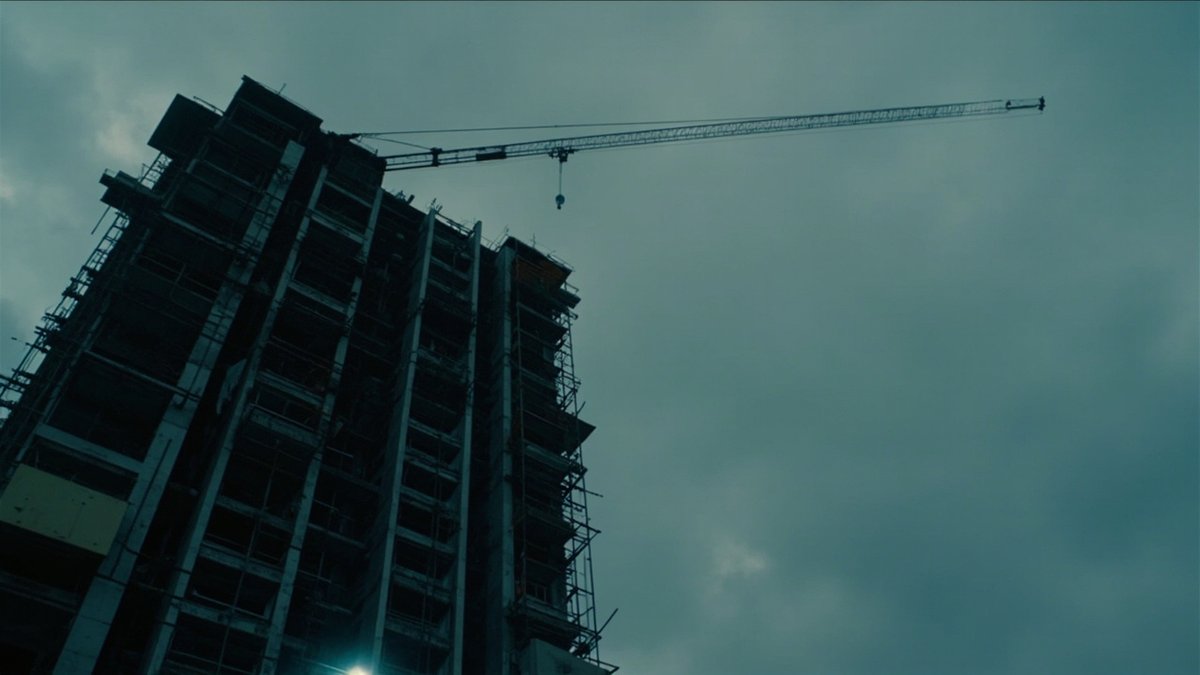A near-finished condo tower with an idle crane represents a late vacant possession LAD claim.