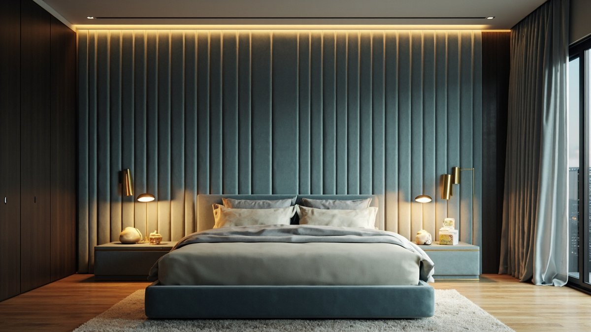Illustrative concept design: full-height dusty-blue channel-tufted velvet bed wall with brass lamps and a matching upholstered bed
