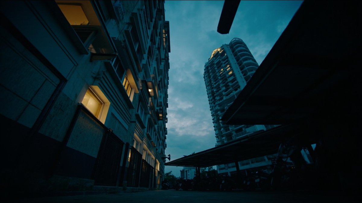 Affordable apartment block exterior at dusk representing rent-to-own housing