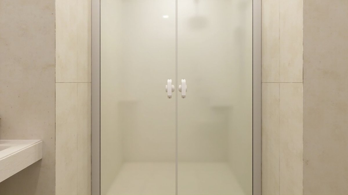 Illustrative concept design: pair of framed frosted glass shower doors with white knobs beside a small basin