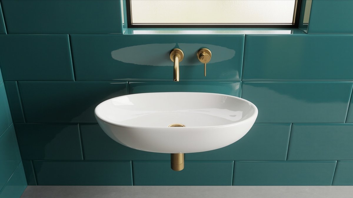 Illustrative concept design: white oval wall-hung basin with a brushed brass wall mixer on deep teal tiles