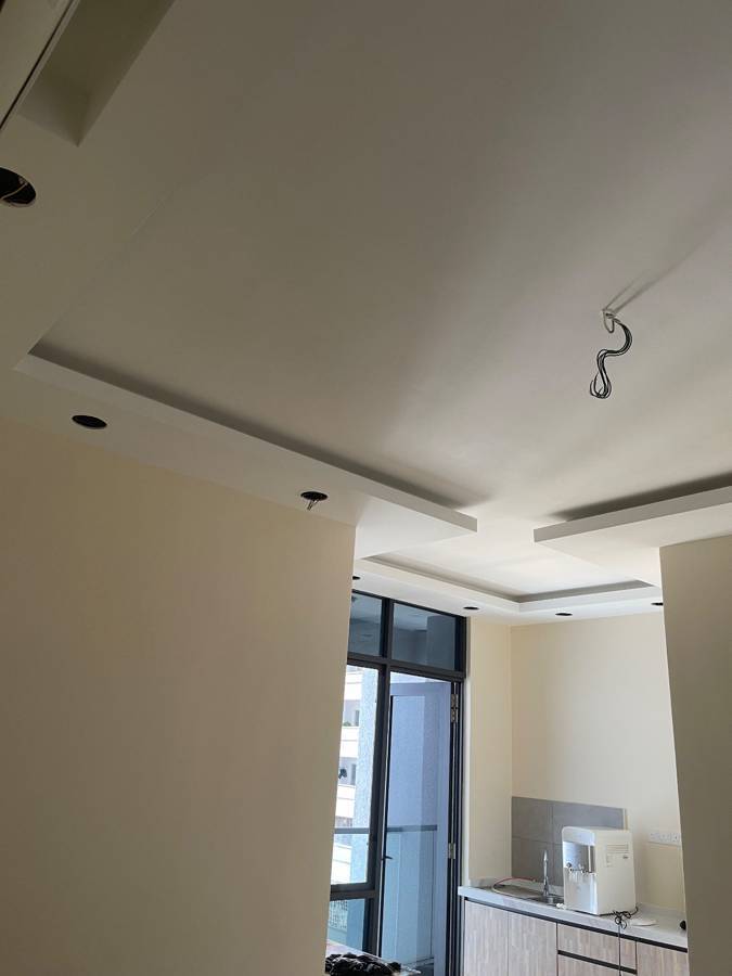 Before: Ceiling fan where bare wiring hung