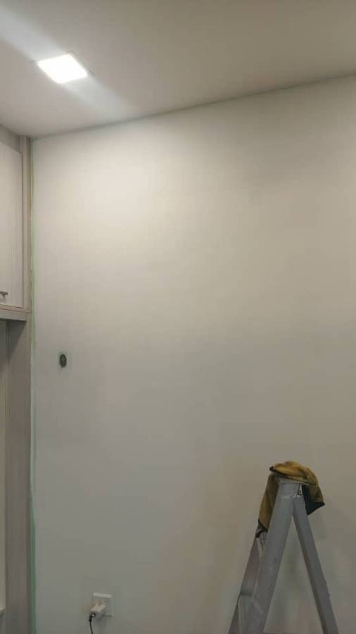 Before: Peeling wall stripped and skim-coated