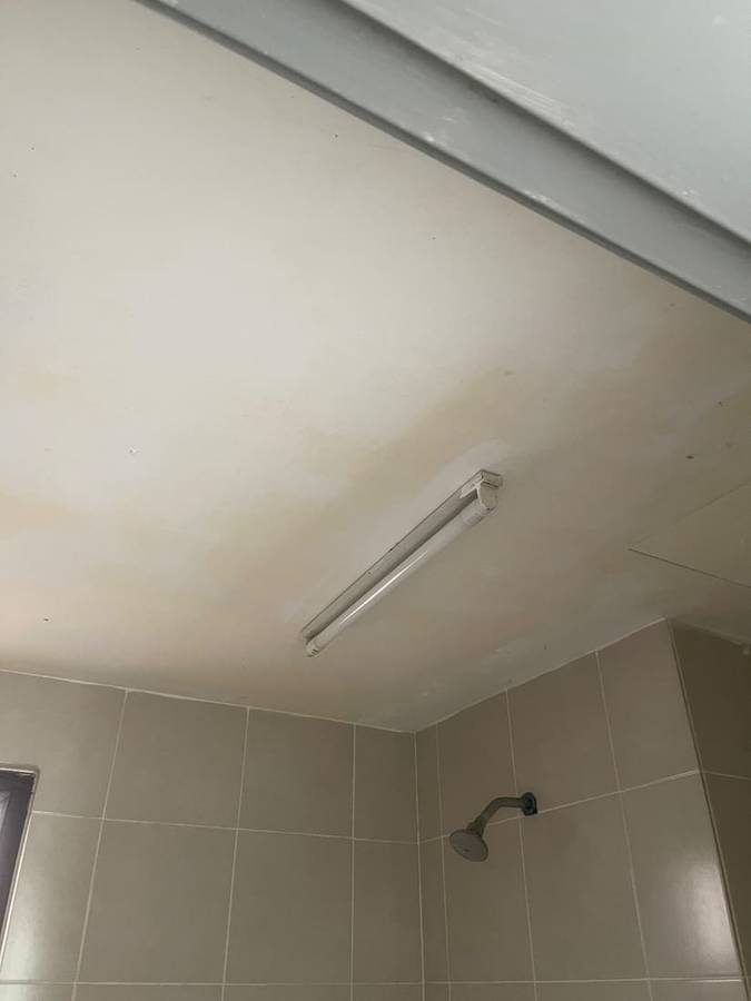 Before: Water-stained ceiling made good