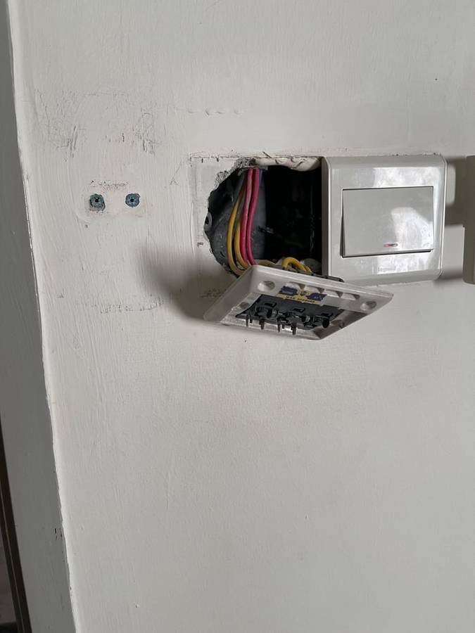 Before: Exposed live wiring made safe